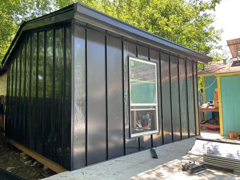 Black standing seam metal wall panels for Roof Inspection in Hurst